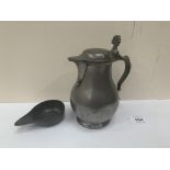 A 19th century pewter lidded jug, 7' high, together with a pewter pourer