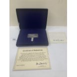 A Concorde commemorative silver ingot by the Danbury Mint. Cased with certificate