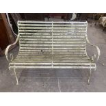 A metal slatted garden seat with scrolled arms. 49' wide