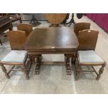 A 1930s/40s oak drawleaf dining table and a set of four dining chairs