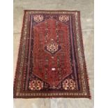 A red ground eastern rug. 54' x 37½'