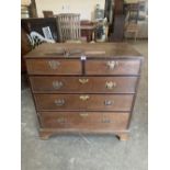 A George III oak chest of two short over three long graduated drawers, raised on bracket feet. 36'