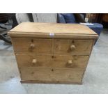 A Victorian pine chest of two short over two long drawers. 35' wide