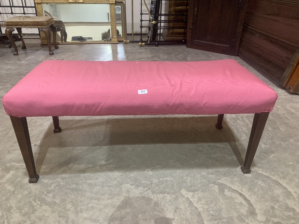 An antique mahogany window seat on square tapered legs. 43' wide