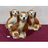 Three Staffordshire spaniels with glass eyes. 13½' high