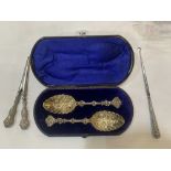 A morocco cased pair of plated berry spoons, with a silver handled boothook and glove stretcher