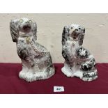 Two 19th century Staffordshire spaniels decorated en-grisaille. 10' x 9¼' high