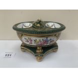 A 19th century Derby porcelain inkstand of oval form, gilded and painted with reserved sprays of