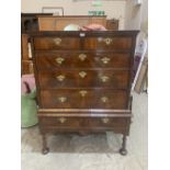 An 18th century walnut chest on stand, the chest with two short over three long drawers, the stand