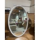 An Edward VII reeded white framed oval looking glass. 37'h x 25'w