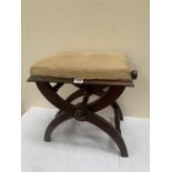 A Victorian X-framed walnut piano stool, the seat adjustable for height. 18' wide