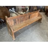 A Victorian pine church pew with blind tracery carved ends. 99' long