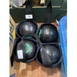 A set of four lawn bowls