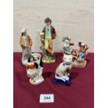 Five small Staffordshire figures, the figure group A.F.