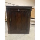 An 18th century oak corner cupboard. 35' high