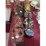Five carved treen ethnic masks