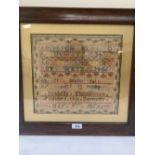 A Victorian needlework sampler worked by Isabella Thomlinson May 5th 1876, with alphanumeric