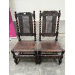 A pair of Jacobean joined oak side chairs, the solid seats formerly caned