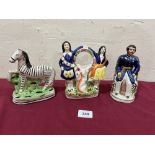 A Staffordshire zebra, 6¼' high (losses); a watch holder group and a Prince Albert pastille