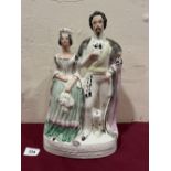 A 19th century Staffordshire group, Queen and King of Sardinia. 14' high