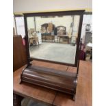 A late Victorian mahogany dressing table mirror, the base enclosed by a convex lid. 33' high