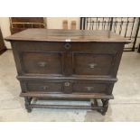 A late 17th century joined oak dower chest, the moulded top over two fielded false drawers and a