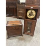 An oak coal box and an oak wall clock (A.F.)