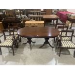 A Regency style drawleaf dining table and six sabre legged chairs