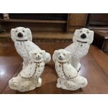 Two pairs of Staffordshire spaniels, the taller pair 11½' high and 19th century, the smaller pair