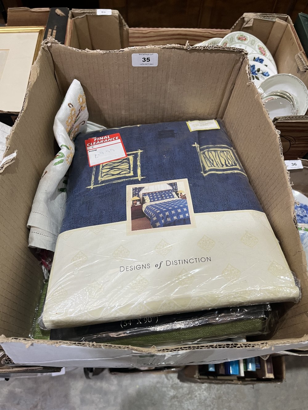 A box of curtains and linen