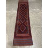 A Meshwani carpet runner. 2.44m x 0.62m