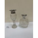 A silver topped cut glass scent bottle and a silver rimmed vase