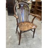 A 19th century ash and elm wheelback elbow chair