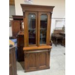 A Victorian mahogany glazed bookcase. 35'w x 80'h