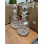 A pair of cut glass mallet form decanters. 10½' high