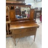 An Edward VII mahogany and inlaid dressing chest, 42' wide; together with a 4'6' bedstead