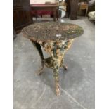 A cast iron garden table on figural moulded cabriole legs. 23' diam.