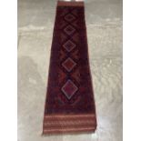 A Meshwani carpet runner. 2.6m x 0.61m