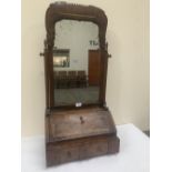 A Queen Anne walnut dressing table bureau looking glass, the bevelled plate within a moulded