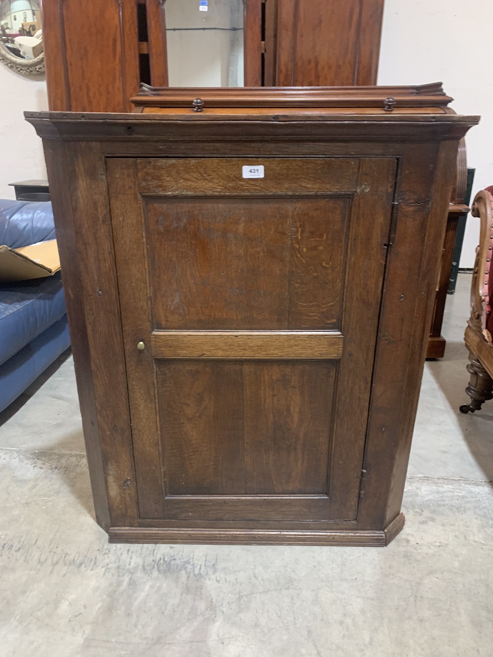 An early 19th century joined oak hanging corner cupboard. 39' high