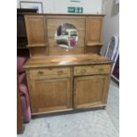 An early 20th century pitch pine sideboard with raised mirror back. 56' wide