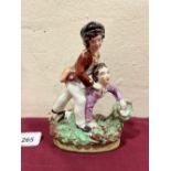 A 19th century Staffordshire group of two boys at play. 6' high