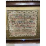 A Victorian needlework sampler worked by Isabella Thomlinson May 5th 1876, with alphanumeric