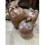 Three large salt glazed earthenware bottle jars