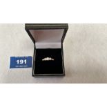 An 18ct three stone diamond ring, each stone 0.1ct approx. Size M. 3.2g