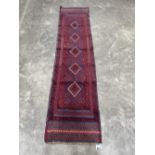 A Meshwani carpet runner. 2.5m x 0.61m