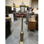 A brass and copper lamp standard in the form of a street lamp. 67' high