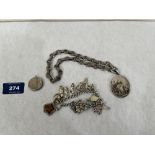 A quantity of silver jewellery to comprise heavy locket and chain; locket and a charm bracelet.