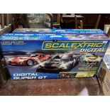 Two Scalextric digital racing sets, one as new