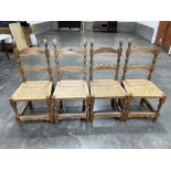 A set of four rush seated kitchen chairs